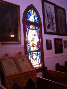 This area is to the side of the candles and displays nicely one of the beautiful stained glass windows